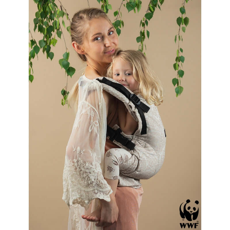 Isara The One - Majestic Ivory Forest baby carrier in use by a mother with child, showcasing comfort and style | Babymaxi