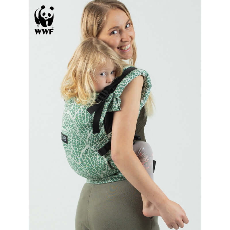 Isara The One - Majestic Green Forest baby carrier for infants and toddlers, worn by parent with child | Babymaxi