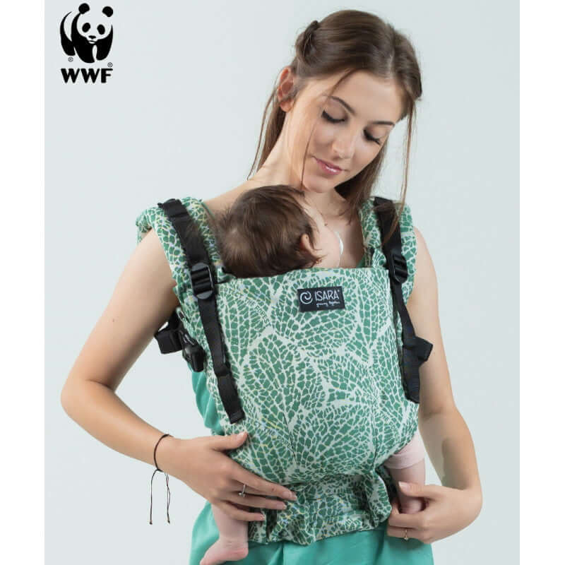 Isara The One - Majestic Green Forest baby carrier in use, a mother carrying a baby, designed for all shapes and sizes | Babymaxi