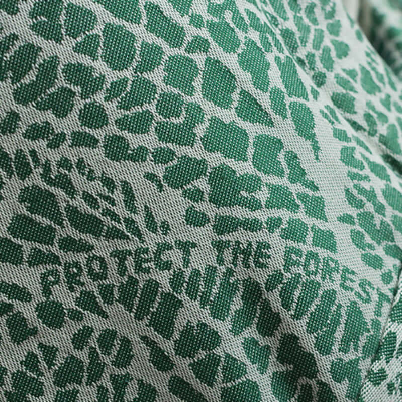 Isara The One - Majestic Green Forest baby carrier fabric with green pattern and message 'Protect The Forest' | Babymaxi