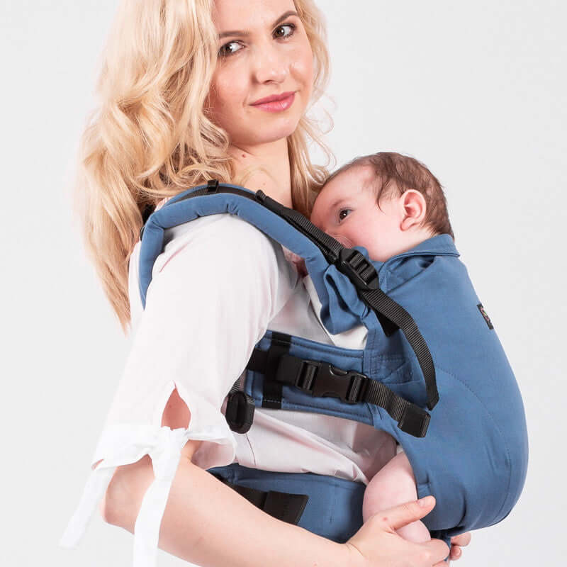 Mother using Isara The One - Bluestone baby carrier for ergonomic support and comfort | Babymaxi