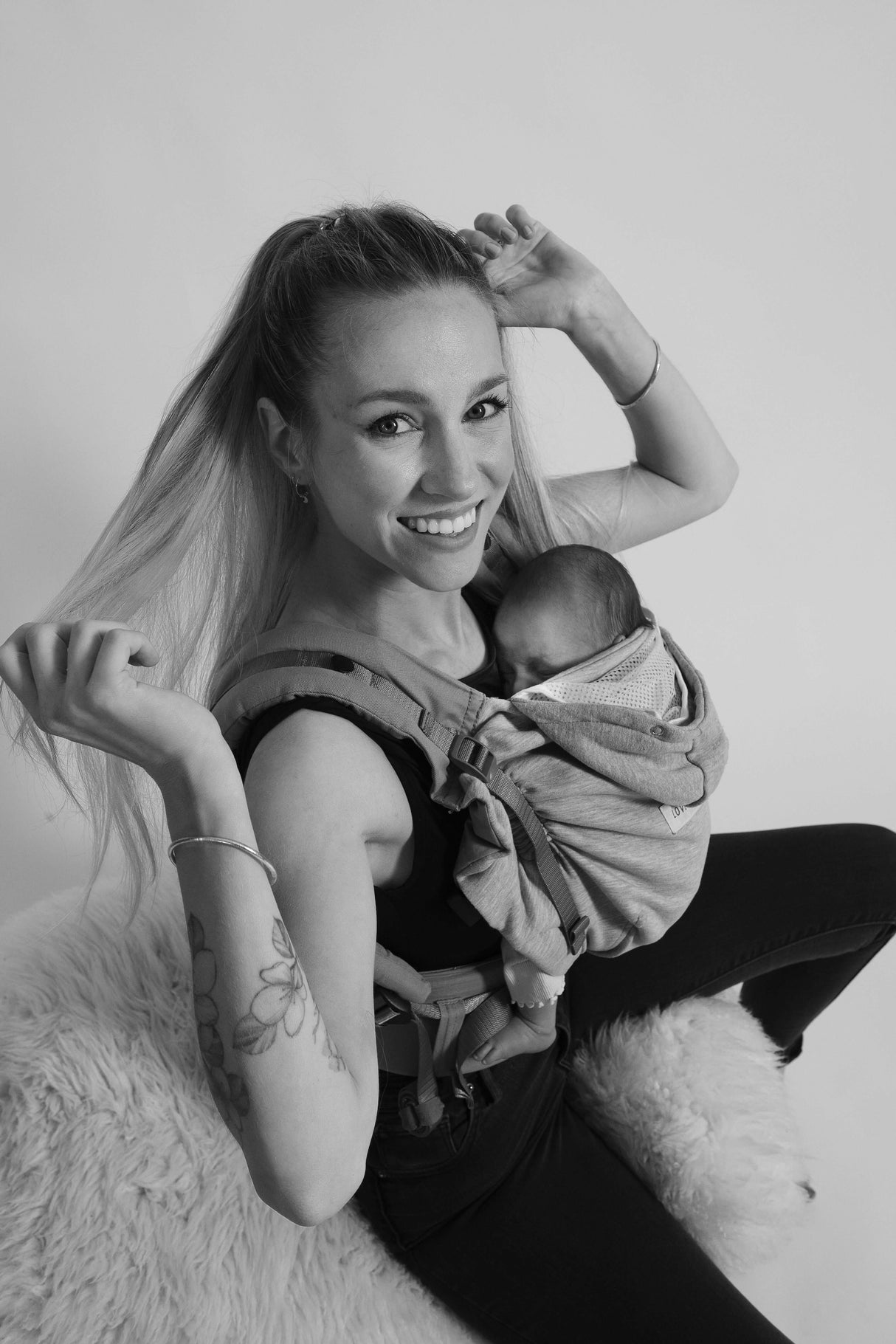 Happy mother using Love Radius HoodieCarrier 2 - Athletic Grey with her baby, showcasing comfort and style | Babymaxi