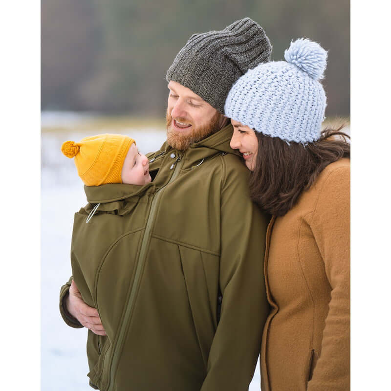 Happy family wearing Mamalila Softshell Allrounder Babywearing Jacket for men - Khaki in winter setting | Babymaxi