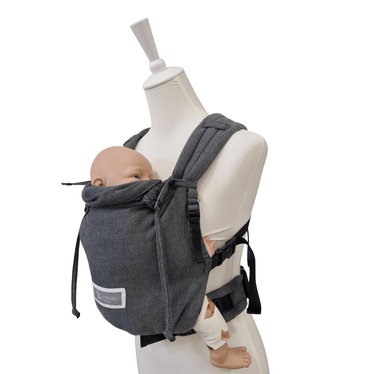 Stochenwiege Valeno Baby Carrier - Graphite on mannequin with baby; ergonomic full-buckle design | Babymaxi