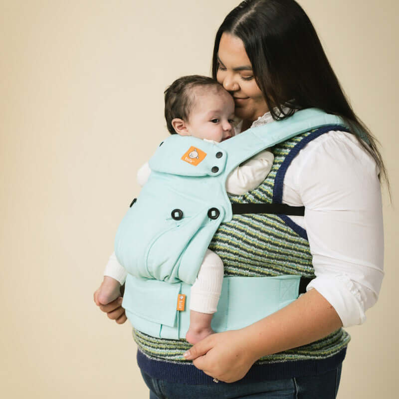 Tula Linen Explore - Robin baby carrier in use, featuring a mother smiling while holding her baby securely | Babymaxi