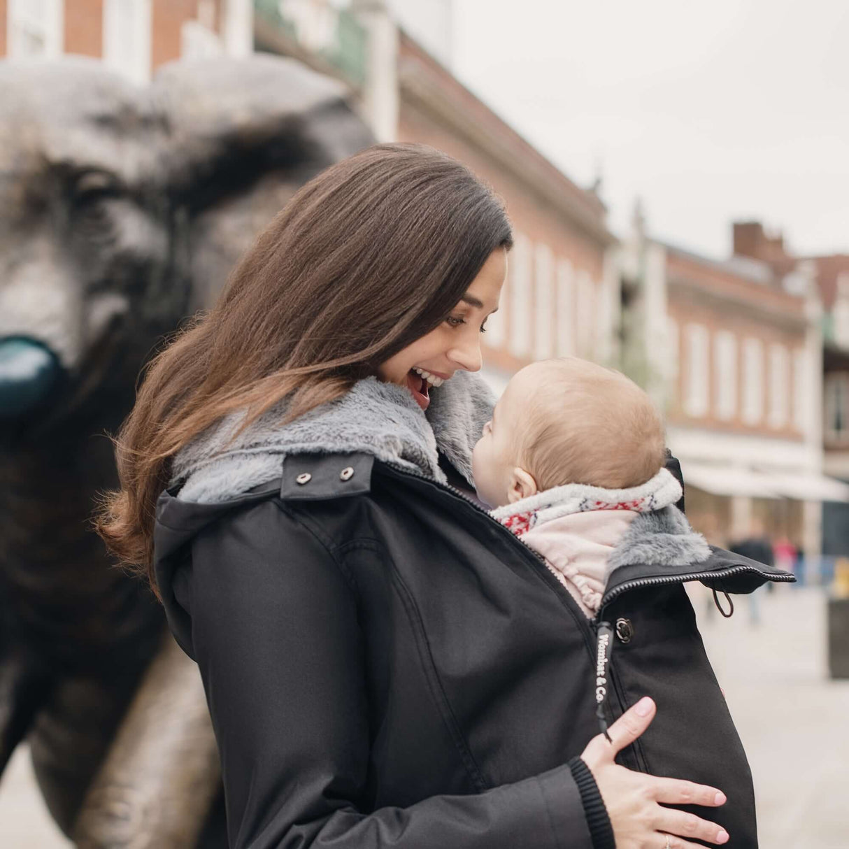 Wombat & Co. London - Wallaby Babywearing Jacket – Black & Charcoal in use with baby | Babymaxi