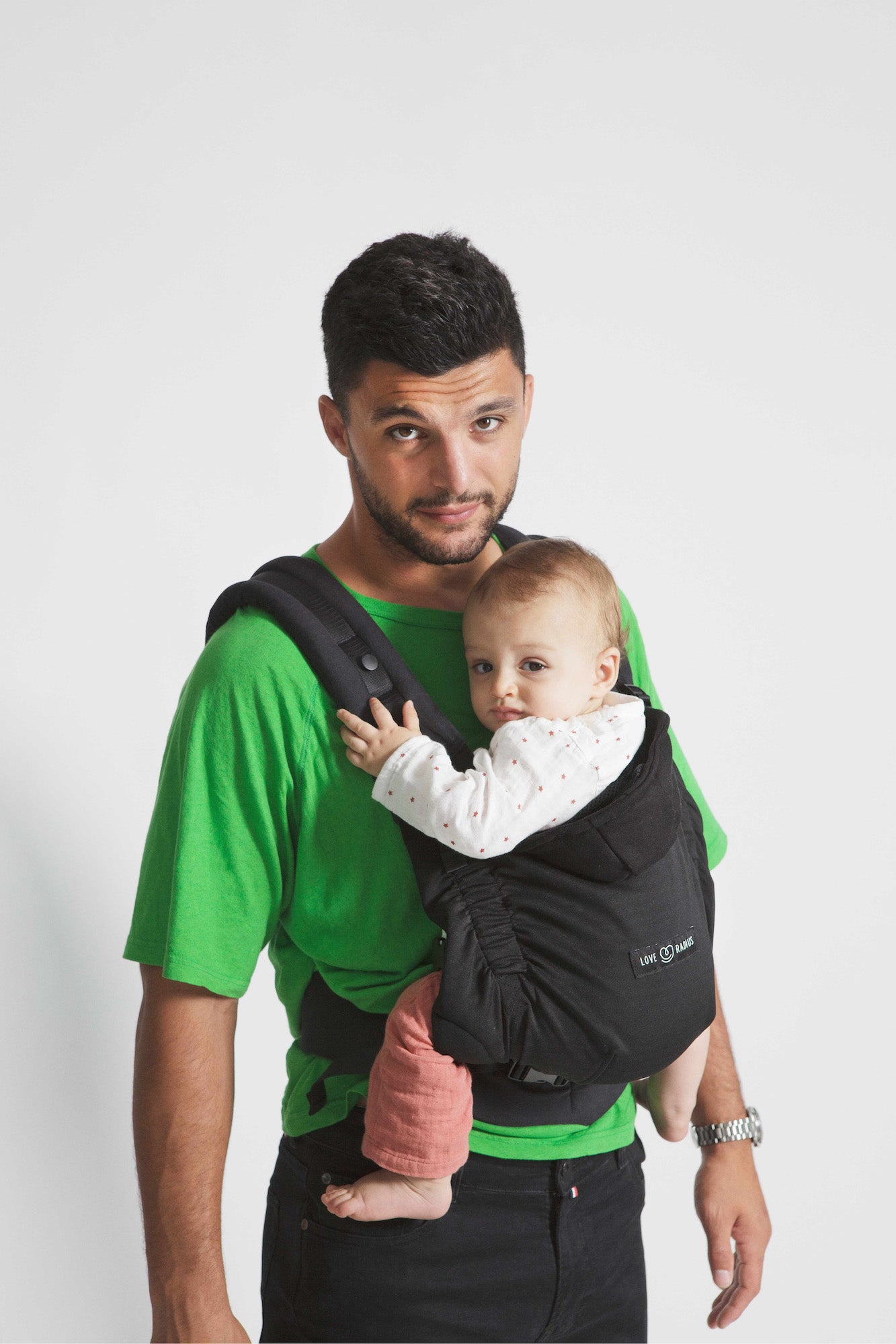 Love Radius HoodieCarrier 2 in black forest being used by a man with a baby, showcasing comfort and support.