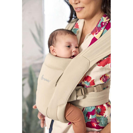 Ergobaby Embrace Soft Air Mesh - Cream baby carrier shown with infant, highlighting comfort and breathable mesh design | Babymaxi