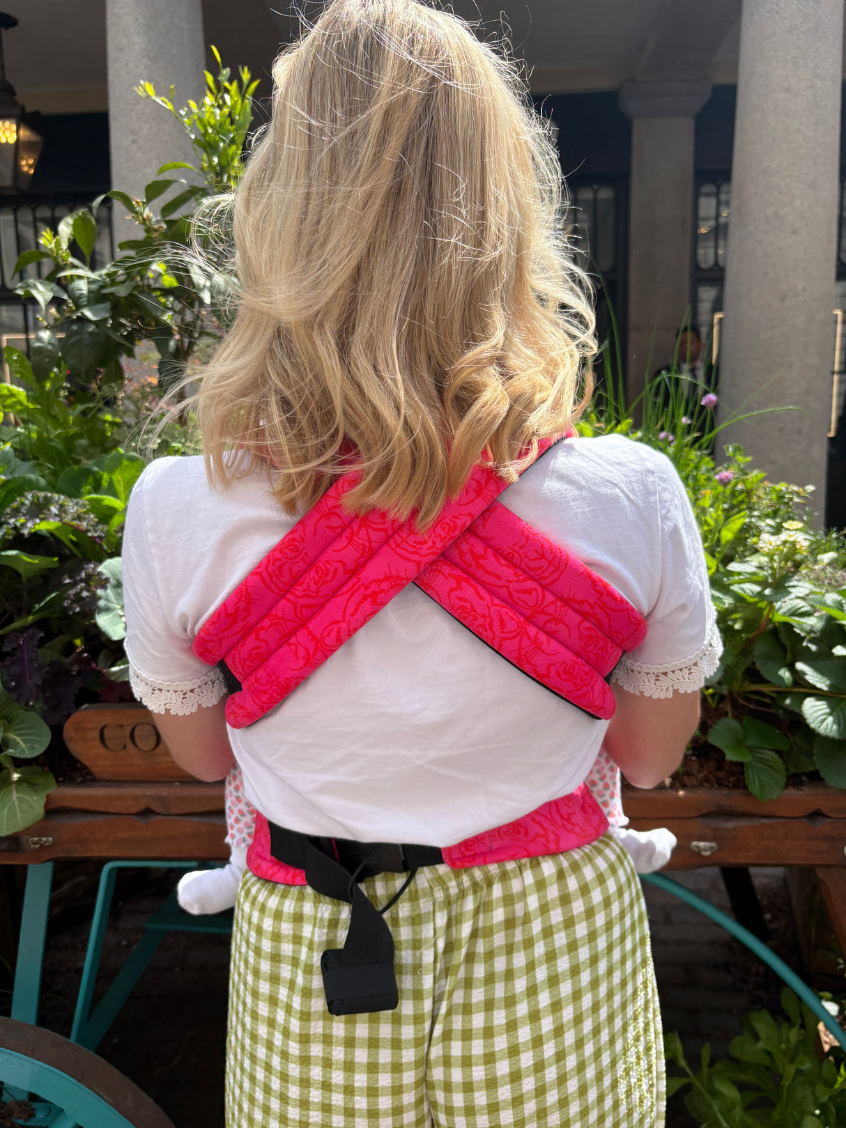 Back view of Nomad Air Roar baby carrier showing crossed shoulder straps and ergonomic fit
