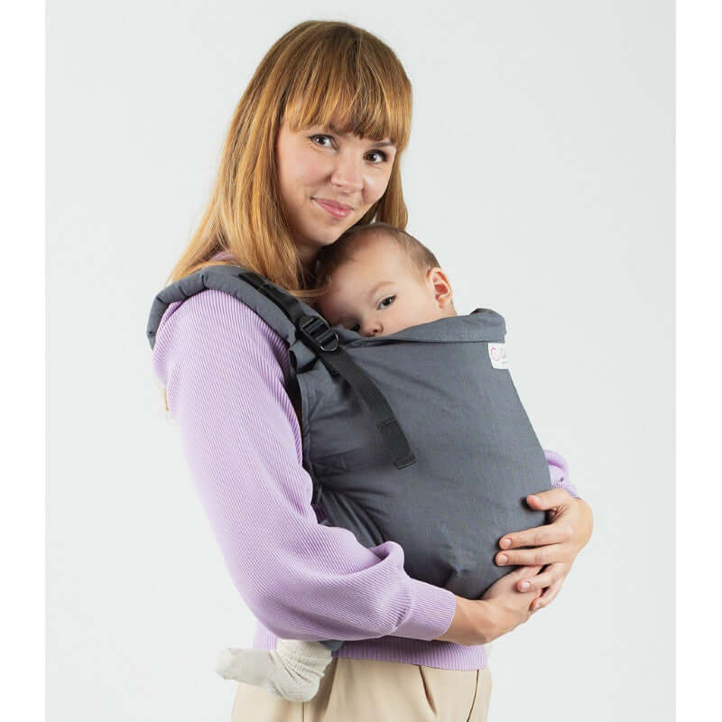 Isara Preschooler (up to 30kg) - Graphite Linen baby carrier worn by a parent with baby | Babymaxi