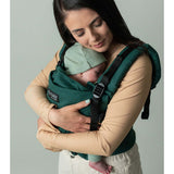 Isara The One - Evergreen Linen baby carrier with a mother holding a sleeping infant | Babymaxi