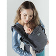 Isara The One - Graphite Linen baby carrier in use, supporting infant comfortably, perfect for family travels | Babymaxi