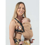 Isara The One - Macchiato baby carrier, features a mom carrying a sleeping baby, ideal for all body types and family adventures | Babymaxi