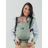 Isara The One - Sage Green Linen baby carrier worn by a smiling parent with a baby, showcasing soft, breathable fabric | Babymaxi