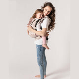 Isara The One - Wildlife Sandy, WWF Collaboration baby carrier with mom and toddler smiling together | Babymaxi