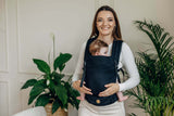 LennyLamb LennyLight - Ebony Black baby carrier in use, features a woman holding a baby securely and comfortably | Babymaxi