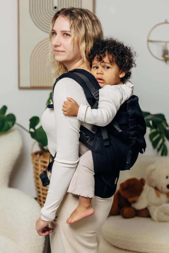 LennyLamb LennyPreschool (up to 30kg) - Little Herringbone Ebony Black toddler carrier in use by parent with child on back | Babymaxi