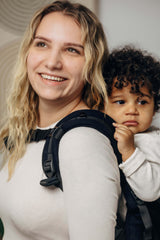 LennyLamb LennyPreschool (up to 30kg) - Little Herringbone Ebony Black toddler carrier used by parent with child | Babymaxi