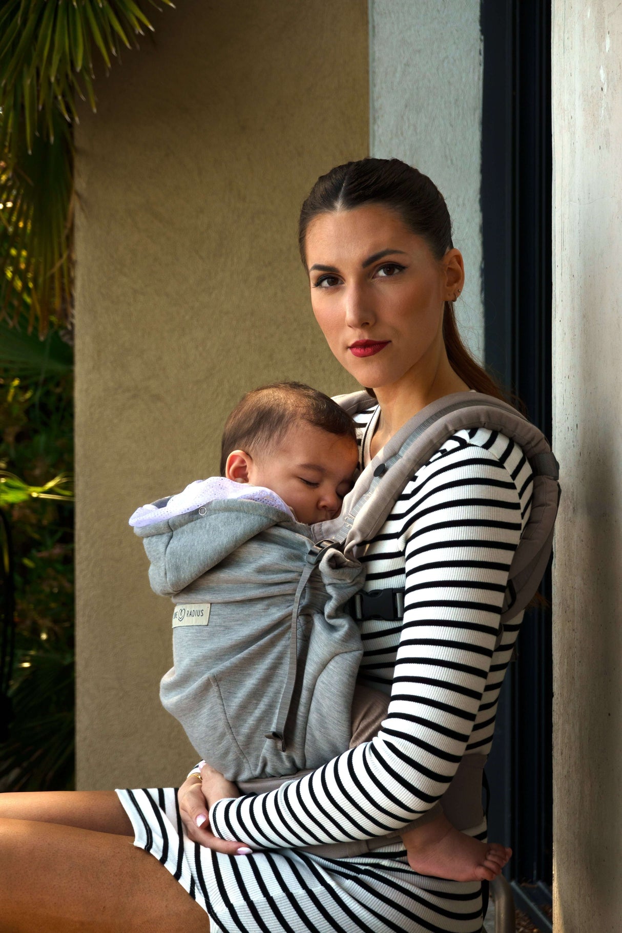 Love Radius HoodieCarrier 2 - Athletic Grey with a mother holding her baby, perfect for newborns to toddlers | Babymaxi