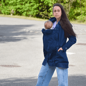 Mamalila Dublin Babywearing Coat – Navy worn by a parent with a baby for stylish and practical babywearing | Babymaxi