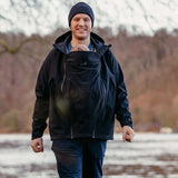 Mamalila Softshell Allrounder Babywearing Jacket for men - Black in a scenic outdoor setting | Babymaxi