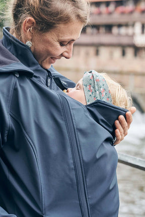 Mamalila Softshell Babywearing Jacket Allrounder - Navy in use with a mother and baby, showcasing comfort and style | Babymaxi
