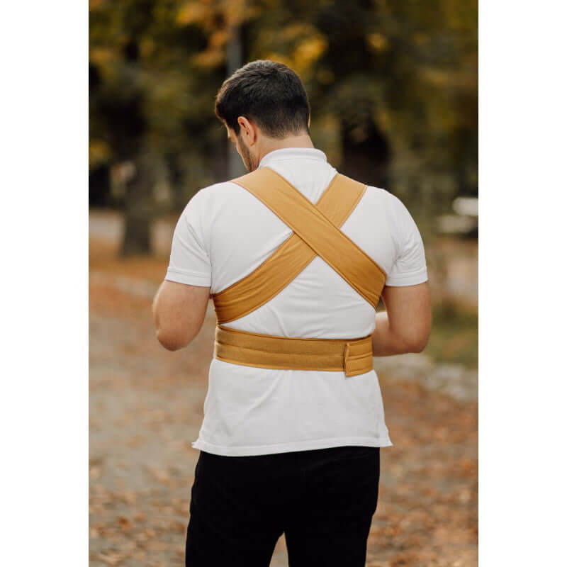 Marsupi Classic - Butterscotch baby carrier model worn by a man, showcasing ergonomic design and Velcro system | Babymaxi