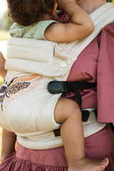 Parent wearing Nomad Air Hexa Bee baby carrier demonstrating hands-free convenience