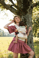 Nomad Air Hexa Bee carrier lifestyle shot showing everyday wearability and parent satisfaction