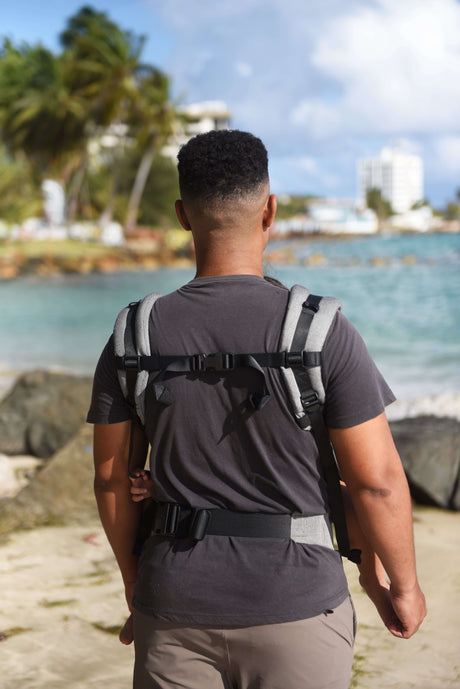 Neko Switch Toddler Carrier - Bold being used on a beach, showcasing ergonomic design and ease of use | Babymaxi