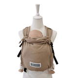 Stochenwiege Valeno Baby Carrier - Sand on a mannequin with a baby, ergonomic and secure design | Babymaxi