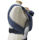 Storchenwiege Talemo Half-Buckle Baby Carrier - Denim displayed on a mannequin with a baby, showcasing its adjustable design | Babymaxi