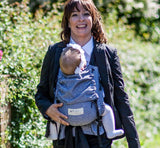 Happy parent wearing the Storchenwiege Talemo Half-Buckle Baby Carrier - Leo Black White with baby | Babymaxi