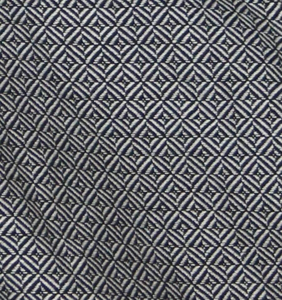 Detailed pattern of the fabric used in the Storchenwiege Talemo Half-Buckle Baby Carrier - Leo Black White | Babymaxi
