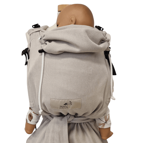 Storchenwiege Talemo Half-Buckle Baby Carrier - Moonstone on a doll showing adjustable design | Babymaxi