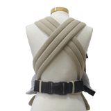 Back view of the Storchenwiege Talemo Half-Buckle Baby Carrier - Natural, showcasing its adjustable straps and buckle.| Babymaxi