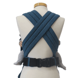 Storchenwiege Talemo Half-Buckle Baby Carrier - Turquoise on a mannequin, showing adjustable straps and buckle | Babymaxi