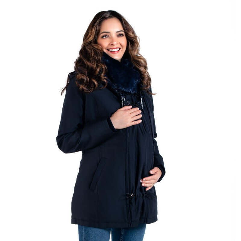 Wombat & Co. London - Wallaby Maternity & Babywearing Coat - Navy worn by a smiling woman | Babymaxi